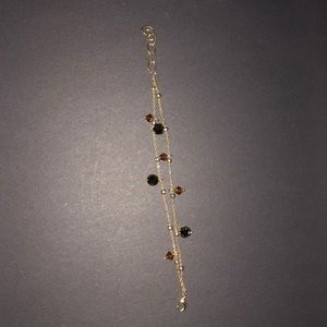 Gold costume with stones double strand bracelet